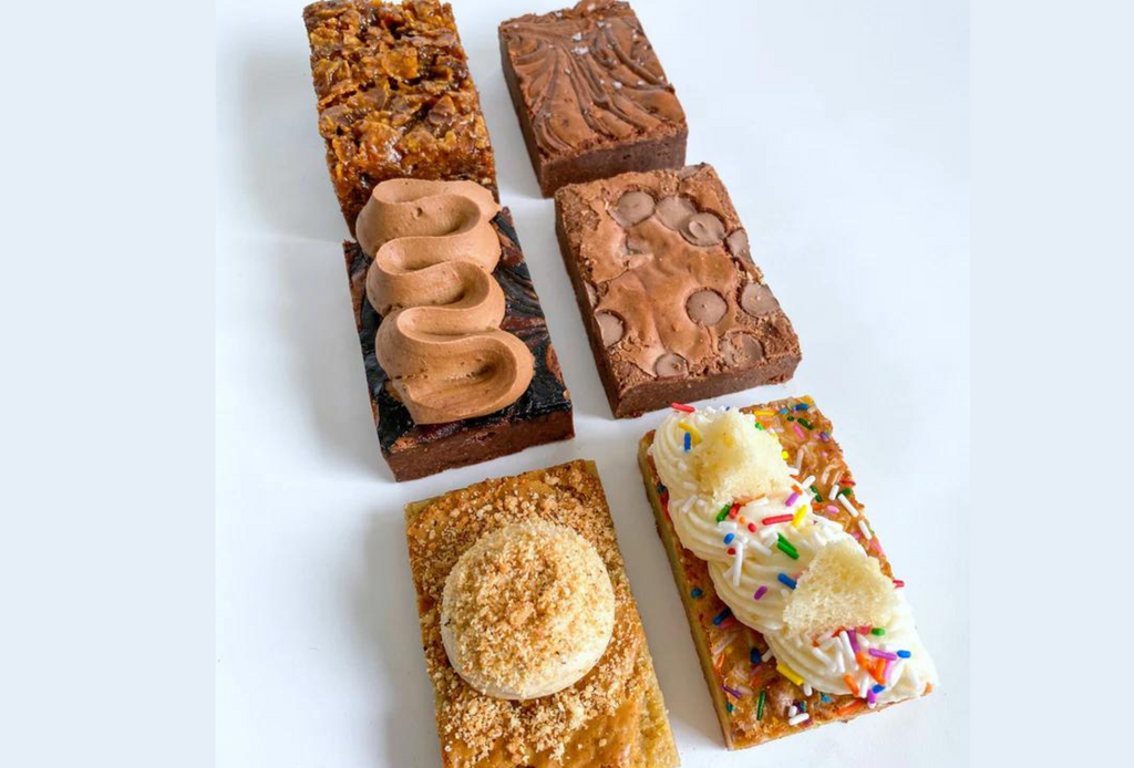 An assortment of decorative brownies on a white background