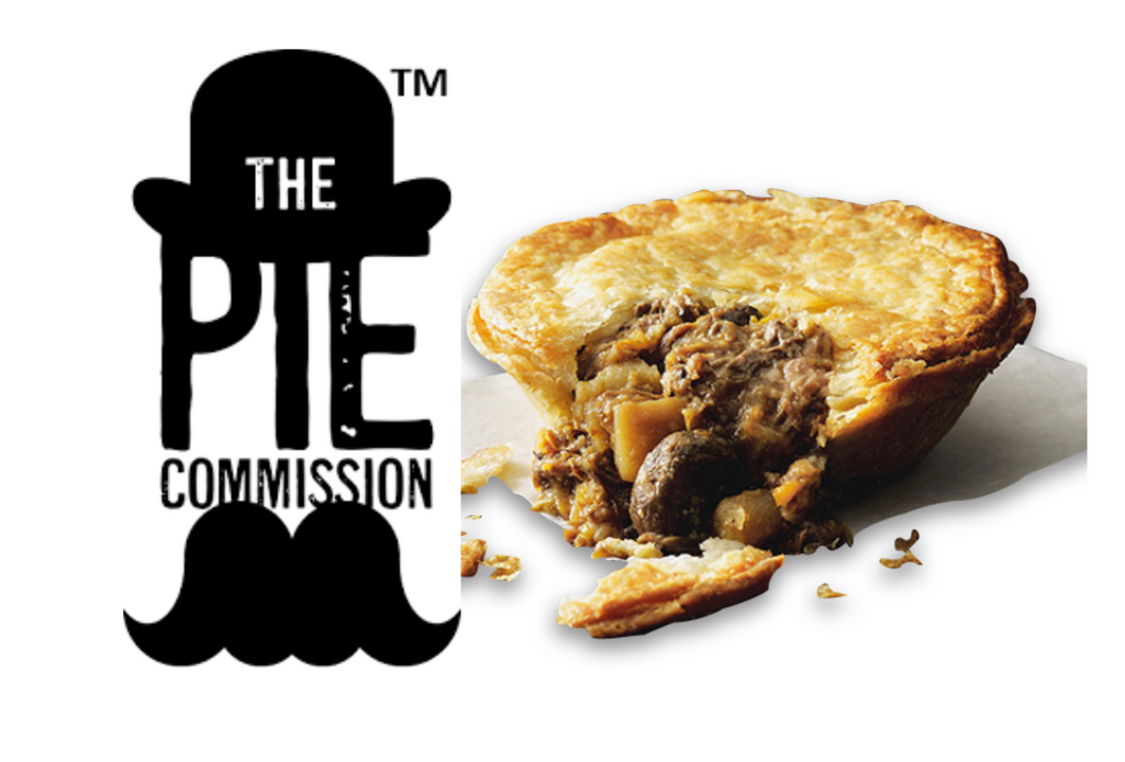 A sliced meat pie from Pie Commission showing ingredients against a white background